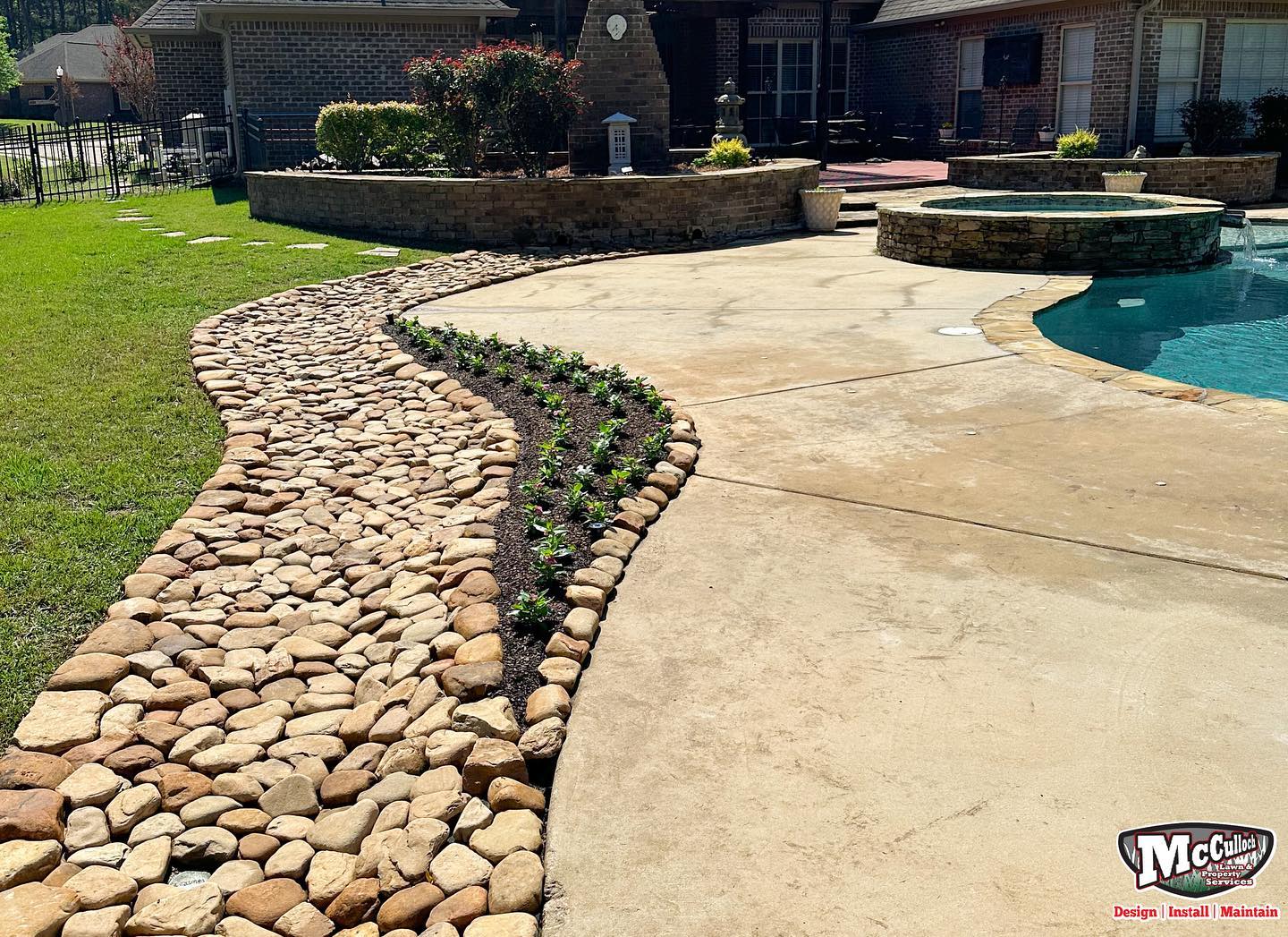 residential rock walkway around the pool